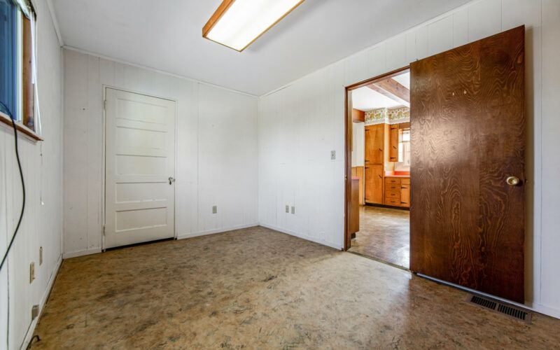 Interior utility room with a doorway to the kitchen at 720 Cleveland Lane